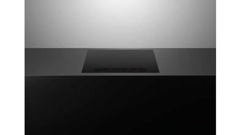 Low-profile side view of the Fisher & Paykel induction cooktop integrated into a countertop Low-profile side view of the Fisher & Paykel induction cooktop integrated into a countertop