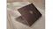 Close-up view highlighting an HP laptop resting on a concrete surface Close-up view highlighting an HP laptop resting on a concrete surface