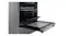 Side angle view of an open oven door showcasing pulled-out wire racks Side angle view of an open oven door showcasing pulled-out wire racks