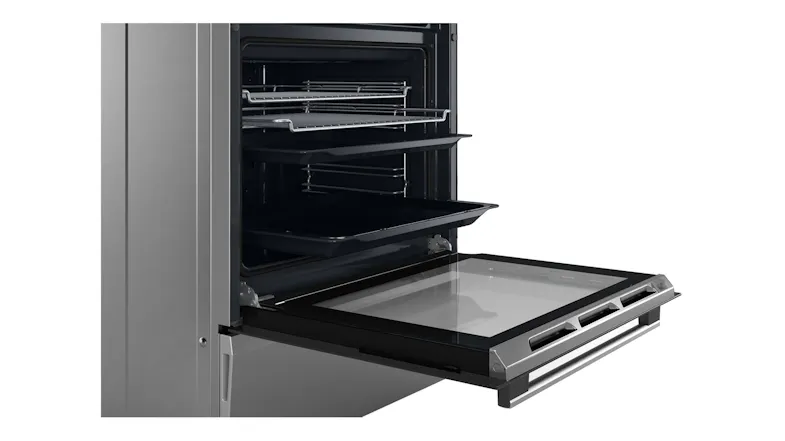 Side angle view of an open oven door showcasing pulled-out wire racks Side angle view of an open oven door showcasing pulled-out wire racks