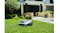 A view of the robotic lawn mower displayed over grass outdoors A view of the robotic lawn mower displayed over grass outdoors