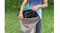 A camper holding a waterproof storage bag for a Bestway air mattress, shown at an outdoor setting A camper holding a waterproof storage bag for a Bestway air mattress, shown at an outdoor setting