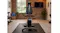 Indoor recumbent fitness bike featuring a comfortable seat and console in a home gym setting Indoor recumbent fitness bike featuring a comfortable seat and console in a home gym setting