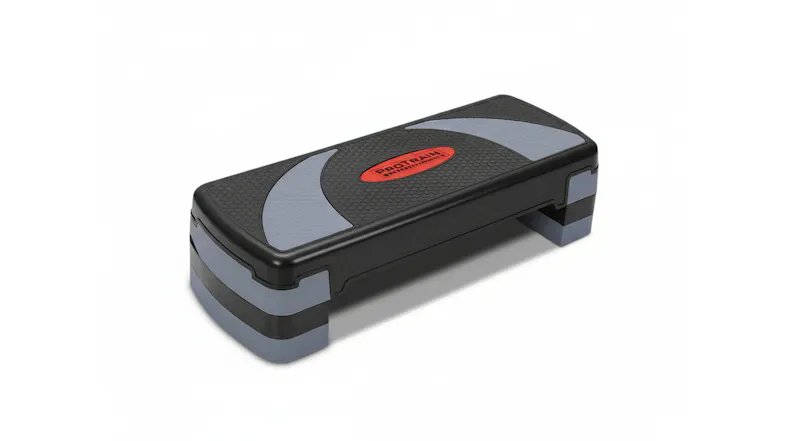 Angled view of a black and grey adjustable aerobic step platform Angled view of a black and grey adjustable aerobic step platform