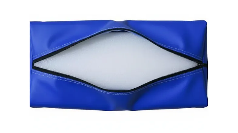 Blue gym mat cover unzipped to reveal dense white foam padding inside Blue gym mat cover unzipped to reveal dense white foam padding inside