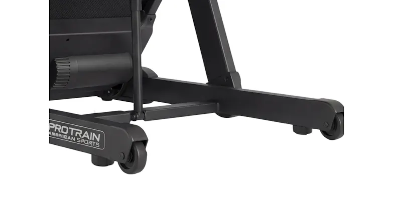 A close-up view of the sturdy metal base frame and transport wheels on a black PROTRAIN treadmill A close-up view of the sturdy metal base frame and transport wheels on a black PROTRAIN treadmill