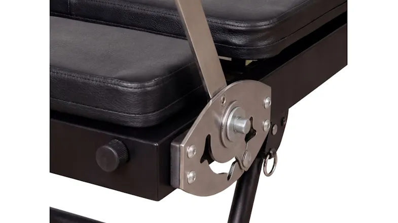 A detailed view of the metal gear hinge mechanism and sturdy base leg of a black folding Pilates reformer machine A detailed view of the metal gear hinge mechanism and sturdy base leg of a black folding Pilates reformer machine