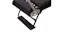 Top-down view focusing on the padded black headrest and frame end of a Pilates reformer machine Top-down view focusing on the padded black headrest and frame end of a Pilates reformer machine