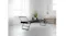 A Pilates reformer in a minimalist room featuring white curtains, a potted plant, and a wooden bench A Pilates reformer in a minimalist room featuring white curtains, a potted plant, and a wooden bench
