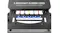 A close-up view of five colored resistance cords under a Pilates reformer carriage labelled with different weight tensions A close-up view of five colored resistance cords under a Pilates reformer carriage labelled with different weight tensions
