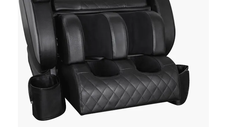 Close-up view of lower leg and foot massage module on Novello massage chair featuring quilted upholstery and side cup Close-up view of lower leg and foot massage module on Novello massage chair featuring quilted upholstery and side cup