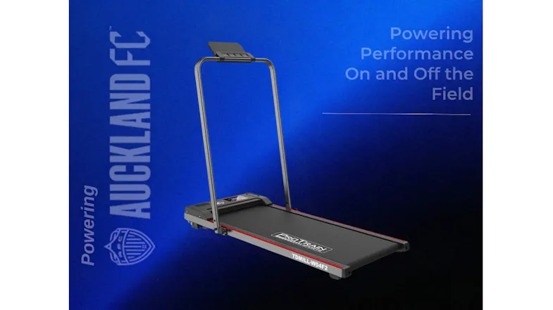 A compact treadmill displayed with Powering Auckland FC text and team logo branding A compact treadmill displayed with Powering Auckland FC text and team logo branding
