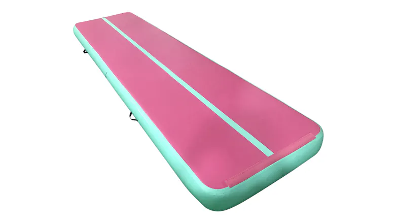 Angled view of a pink and green TSB Living inflatable gymnastics air track Angled view of a pink and green TSB Living inflatable gymnastics air track