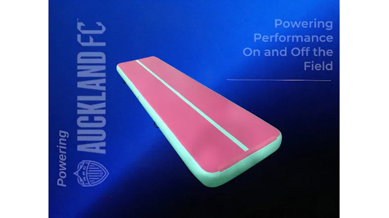 Pink and green inflatable gymnastics mat with a centre stripe on a blue promotional background. Pink and green inflatable gymnastics mat with a centre stripe on a blue promotional background.