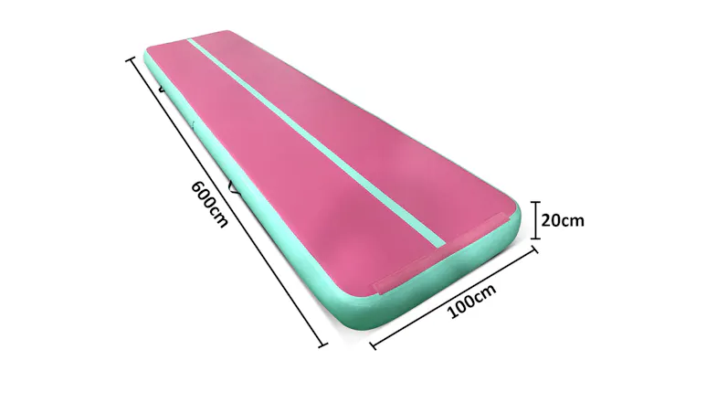 Pink and green inflatable air track mat with dimensions shown: 600 cm long, 100 cm wide, and 20 cm thick Pink and green inflatable air track mat with dimensions shown: 600 cm long, 100 cm wide, and 20 cm thick