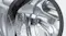 Close-up of the stainless steel drum interior inside the washer dryer Close-up of the stainless steel drum interior inside the washer dryer