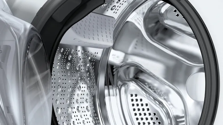 Close-up of the stainless steel drum interior inside the washer dryer Close-up of the stainless steel drum interior inside the washer dryer