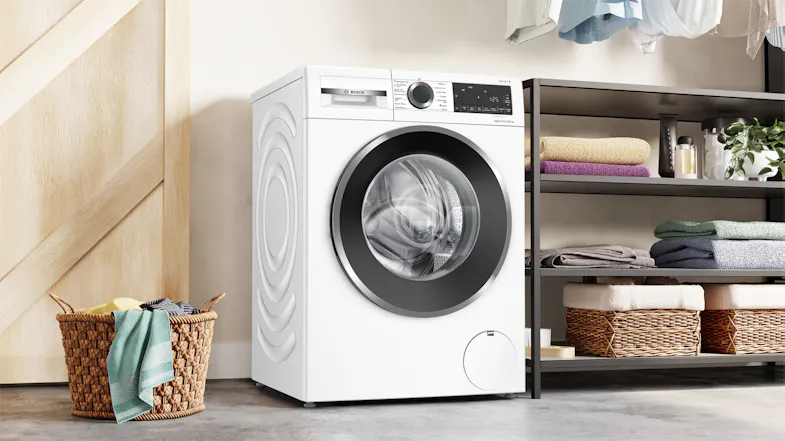 Bosch washer dryer combo positioned in a contemporary laundry space Bosch washer dryer combo positioned in a contemporary laundry space