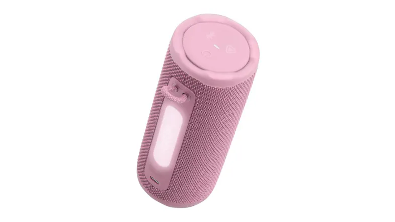 Angled top view of the pink JBL speaker, showing the built-in grip opening Angled top view of the pink JBL speaker, showing the built-in grip opening