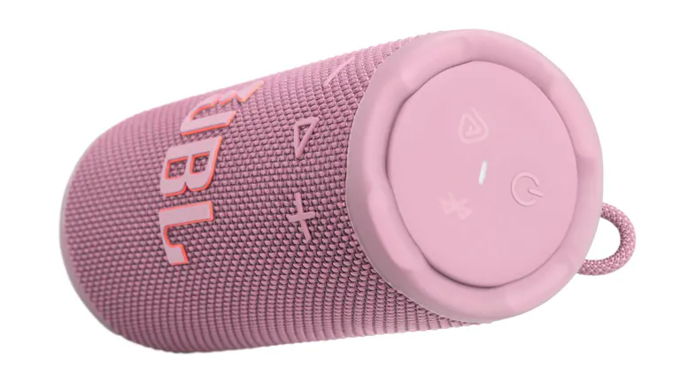 Angled close-up of the pink JBL Grip speaker lying horizontally, showing the top control buttons Angled close-up of the pink JBL Grip speaker lying horizontally, showing the top control buttons