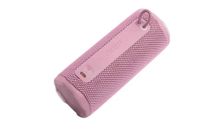 Bottom angled view of the pink portable speaker, highlighting the charging port area and handle opening Bottom angled view of the pink portable speaker, highlighting the charging port area and handle opening