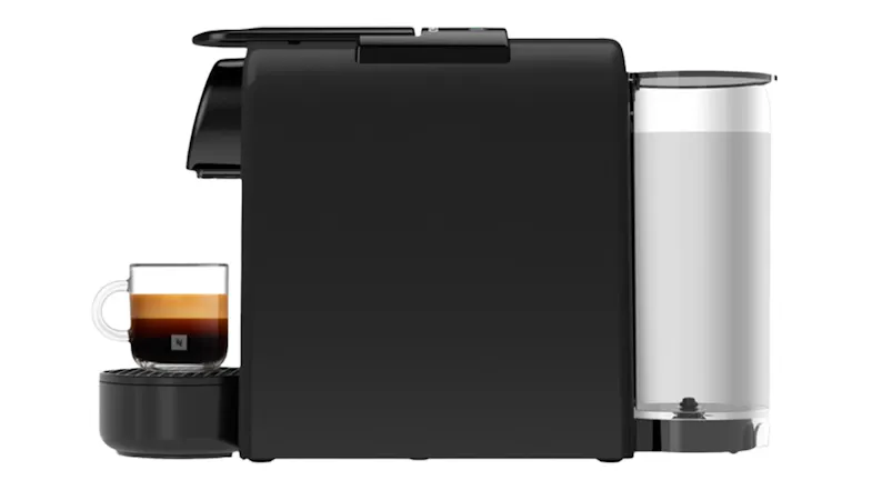 Side view of a DeLonghi Nespresso Essenza Mini with a filled cup and clear rear water tank Side view of a DeLonghi Nespresso Essenza Mini with a filled cup and clear rear water tank