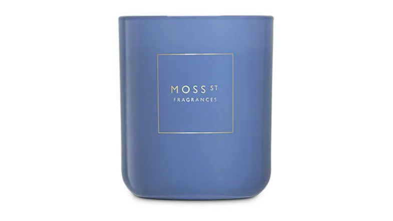 Front view showcasing a cylindrical Moss St. scented candle Front view showcasing a cylindrical Moss St. scented candle