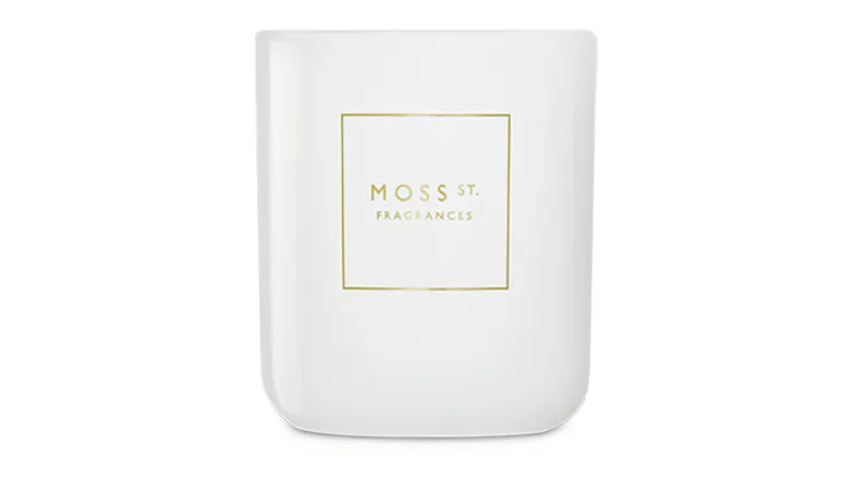 Front view showcasing a cylindrical Moss St. scented candle Front view showcasing a cylindrical Moss St. scented candle