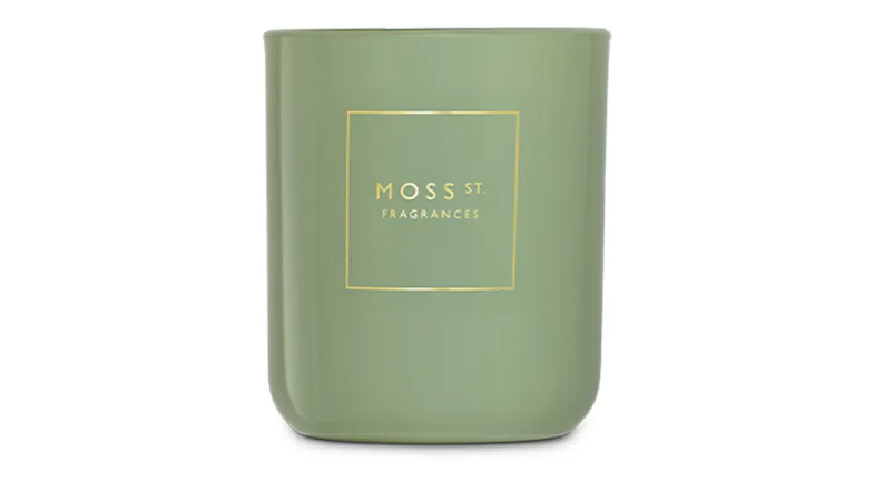Front view showcasing a cylindrical Moss St. scented candle Front view showcasing a cylindrical Moss St. scented candle