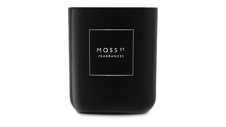 Front view showcasing a cylindrical Moss St. scented candle Front view showcasing a cylindrical Moss St. scented candle