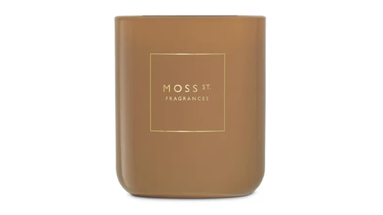 Front view showcasing a cylindrical Moss St. scented candle Front view showcasing a cylindrical Moss St. scented candle