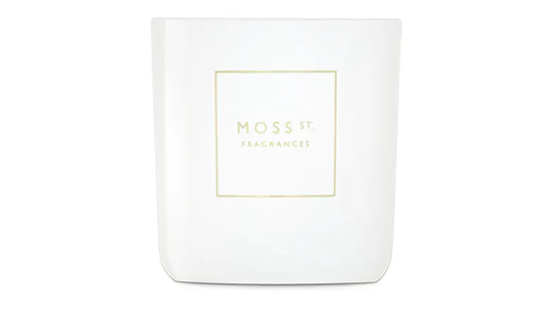 Front view showcasing a cylindrical Moss St. scented candle Front view showcasing a cylindrical Moss St. scented candle