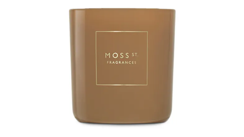 Front view showcasing a cylindrical Moss St. scented candle Front view showcasing a cylindrical Moss St. scented candle