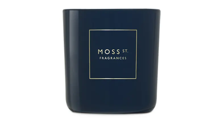 Front view showcasing a cylindrical Moss St. scented candle Front view showcasing a cylindrical Moss St. scented candle