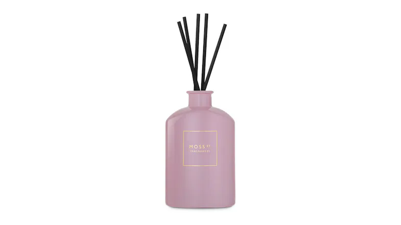 Front view showcasing a Moss St. reed diffuser with black sticks Front view showcasing a Moss St. reed diffuser with black sticks