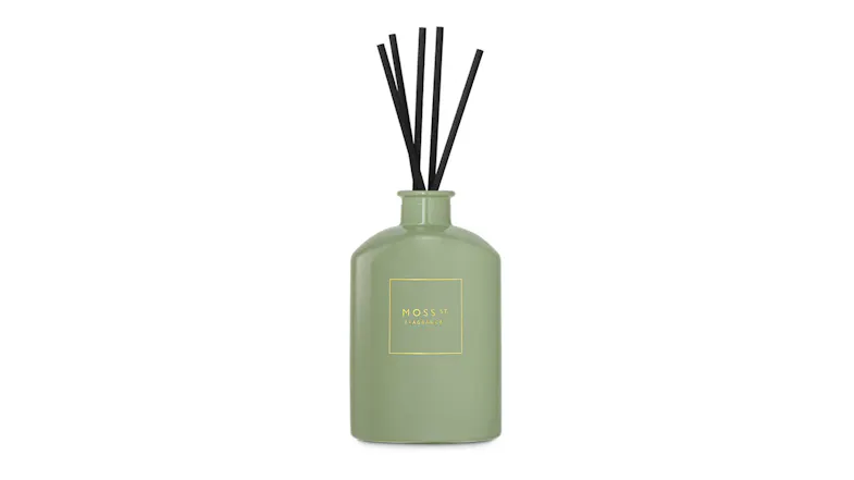 Front view showcasing a Moss St. reed diffuser with black sticks Front view showcasing a Moss St. reed diffuser with black sticks