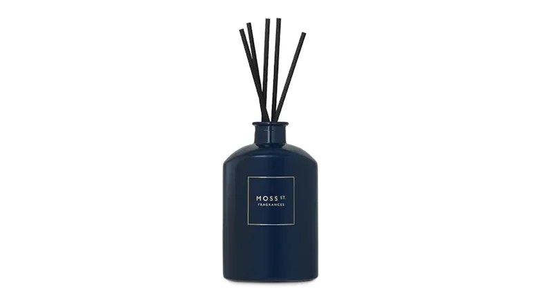 Front view showcasing a Moss St. reed diffuser with black sticks Front view showcasing a Moss St. reed diffuser with black sticks