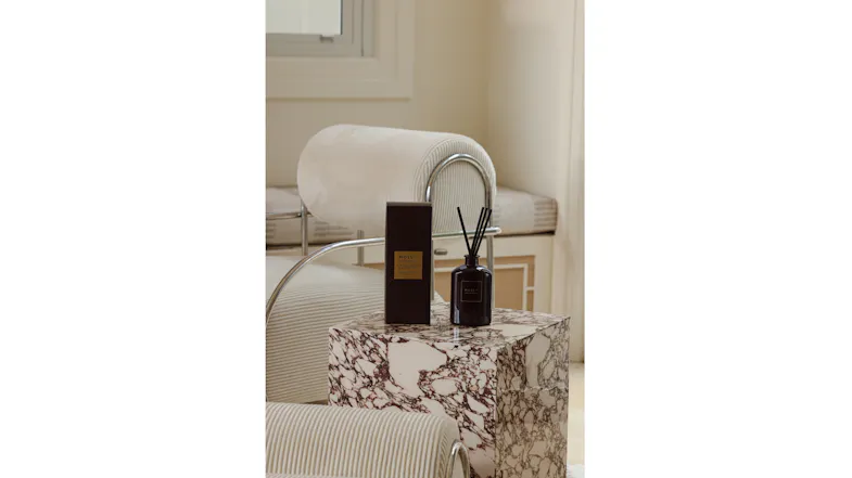 Vintage Leather & Cedarwood reed diffuser set displayed in a modern, stylish interior setting Vintage Leather & Cedarwood reed diffuser set displayed in a modern, stylish interior setting