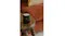 Warm living area showcasing a lit candle on rustic wooden table Warm living area showcasing a lit candle on rustic wooden table