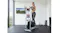 Person exercising on a ProTrain Sports elliptical trainer with built-in dumbbells in a modern home gym Person exercising on a ProTrain Sports elliptical trainer with built-in dumbbells in a modern home gym