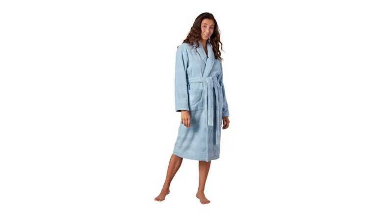 Baksana Ava Bath Robe in light blue, shown on a standing model, highlighting the shawl collar Baksana Ava Bath Robe in light blue, shown on a standing model, highlighting the shawl collar