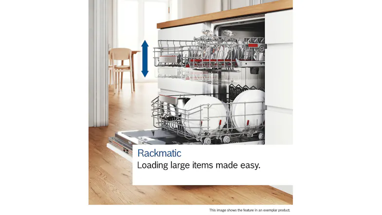 Kitchen scene featuring loaded racks pulled out from open dishwasher Kitchen scene featuring loaded racks pulled out from open dishwasher