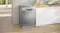 Freestanding view showcasing dishwasher placed in a bright kitchen space Freestanding view showcasing dishwasher placed in a bright kitchen space