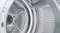 Macro view of the heat pump dryer showing the interior drum filter Macro view of the heat pump dryer showing the interior drum filter