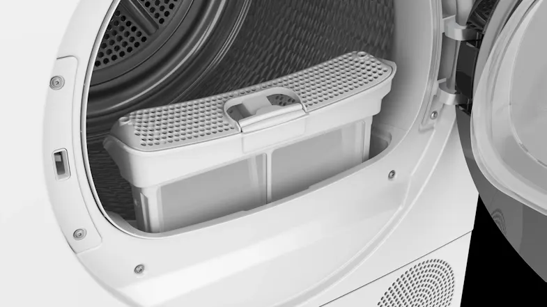 An open dryer door showcasing a shoe drying basket placed inside An open dryer door showcasing a shoe drying basket placed inside