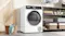 Modern laundry space featuring the dryer placed on tiled flooring Modern laundry space featuring the dryer placed on tiled flooring