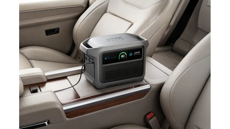 Anker SOLIX portable power station charging inside a vehicle on the centre console Anker SOLIX portable power station charging inside a vehicle on the centre console