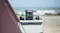 Compact portable power station providing off-grid power at a seaside camping setup Compact portable power station providing off-grid power at a seaside camping setup