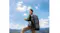 An outdoor adventurer charging a device with an Anker SOLIX portable power station and solar panel backpack An outdoor adventurer charging a device with an Anker SOLIX portable power station and solar panel backpack