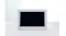 Front view featuring touchscreen calendar resting on white desk Front view featuring touchscreen calendar resting on white desk